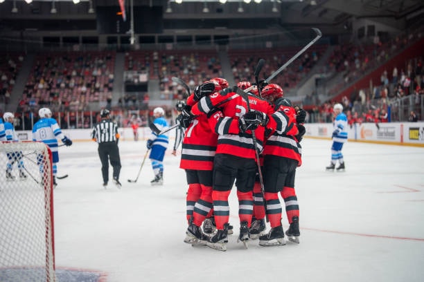Hockey team celebrating on ice
